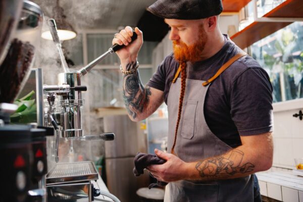 barista preparing coffee machine during work